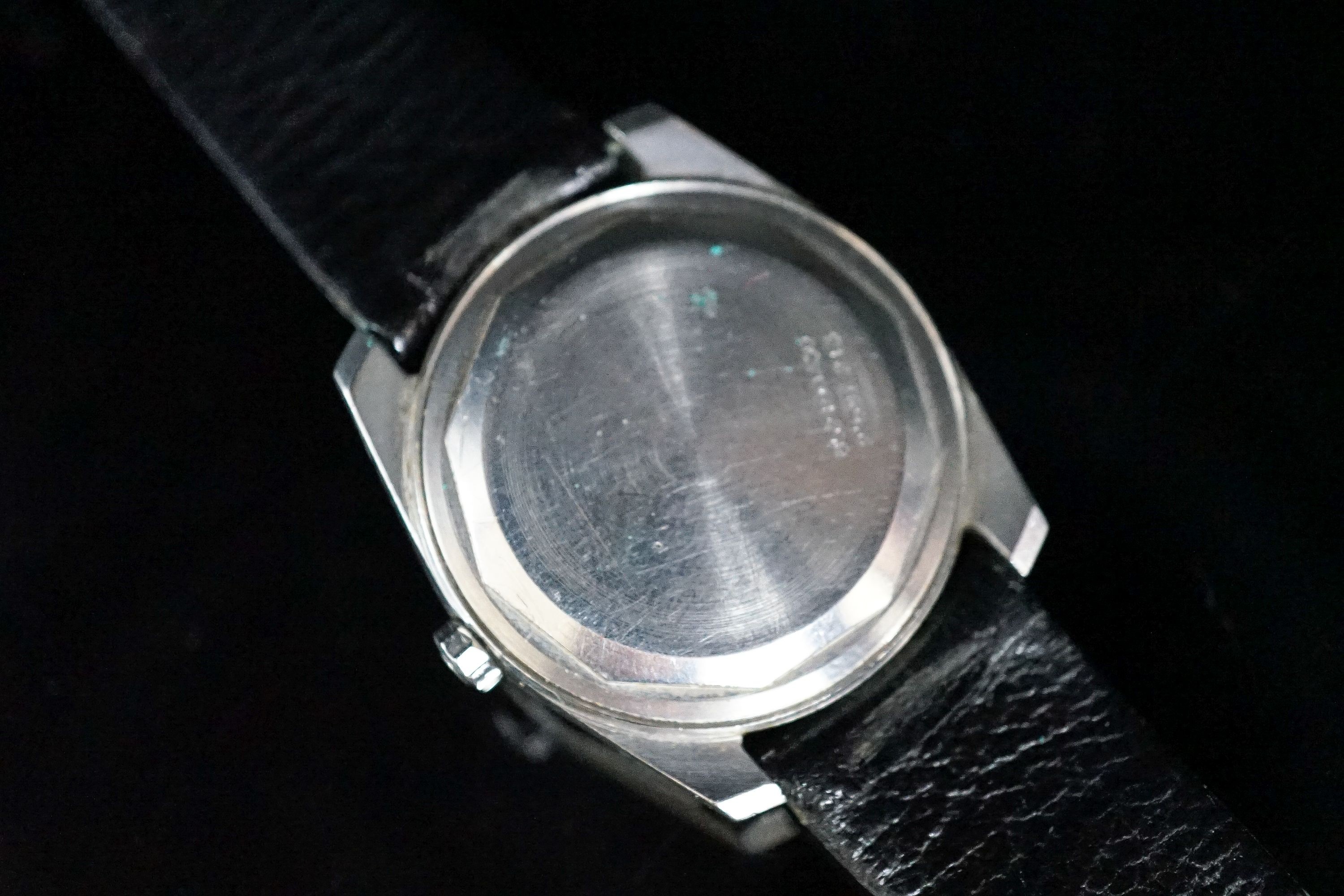 A gentleman's stainless steel Universal Unisonic quartz wrist watch, on a leather strap, case diameter 34mm.